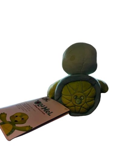 Toy turtle with wheels and a pink card featuring a turtle illustration on a white background