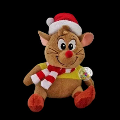 Plush toy reindeer wearing a Santa hat and scarf on a white background