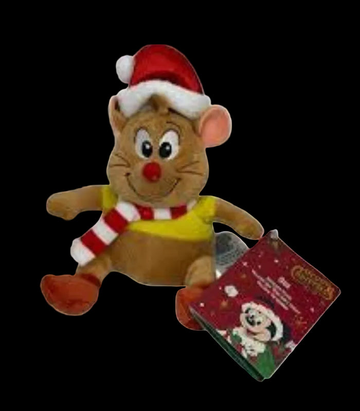 Plush toy of a cat in a Santa hat and scarf with a small book on a white background