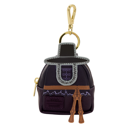 Keychain shaped like a character in a dark outfit with gold accents on a white background