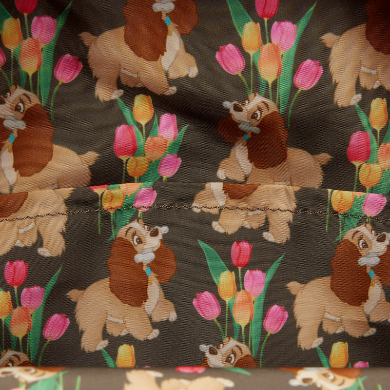 Fabric with cartoon dog and tulip pattern on a dark background