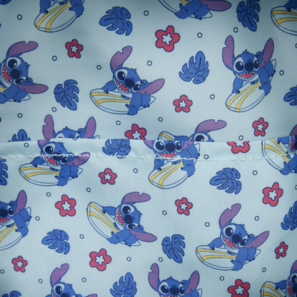 Patterned fabric with cartoon character on a light blue background