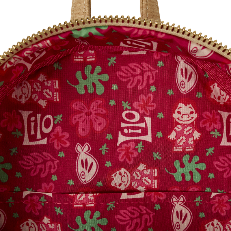 Close-up of a red fabric with 'Lilo' and floral patterns, likely from a Disney product.