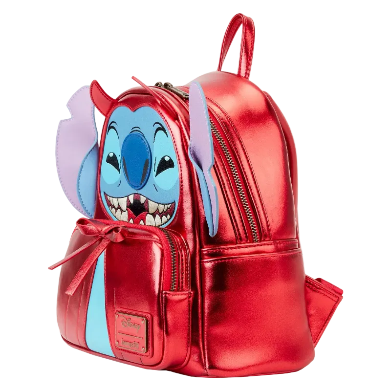 Red metallic backpack with cartoon character face on a white background