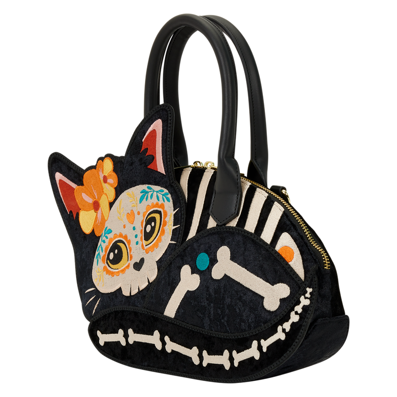 Cat-shaped handbag with Day of the Dead design on a white background