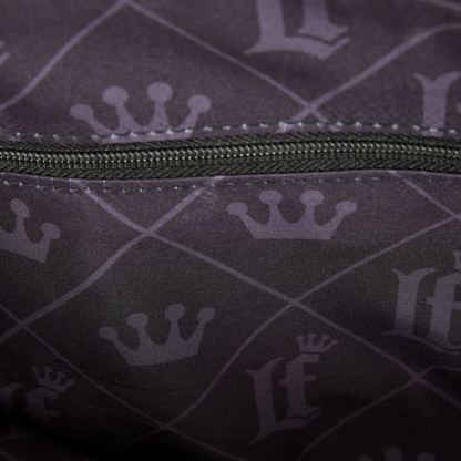 Close-up of a dark fabric with patterns and a zipper