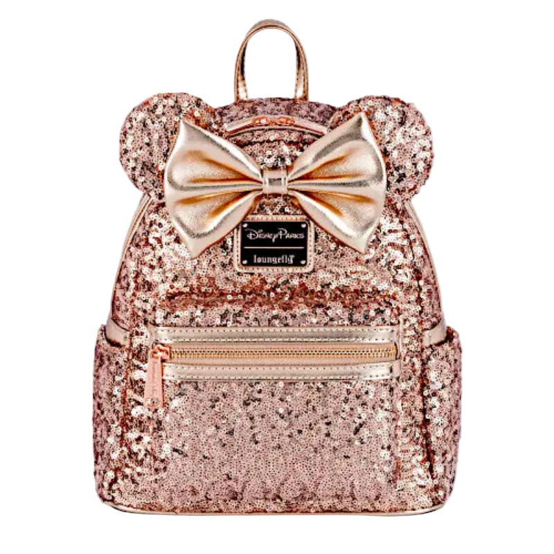 Rose gold glitter backpack with a bow on a white background