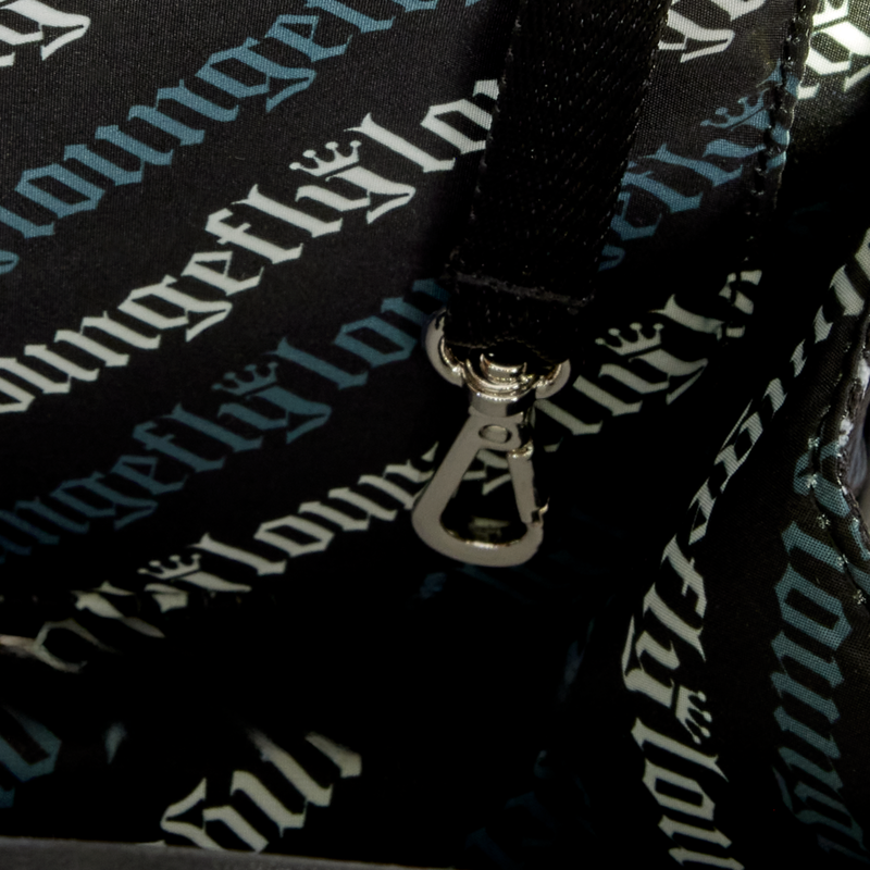 Close-up of a bag with 'The Lounge' branding on a black background