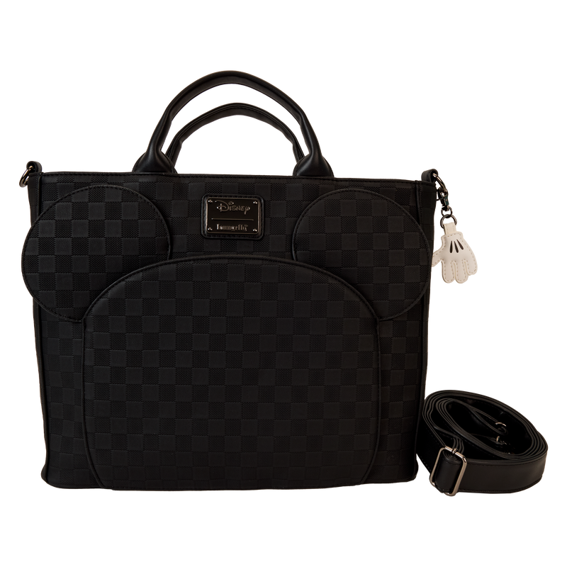 Black quilted handbag with a strap on a white background