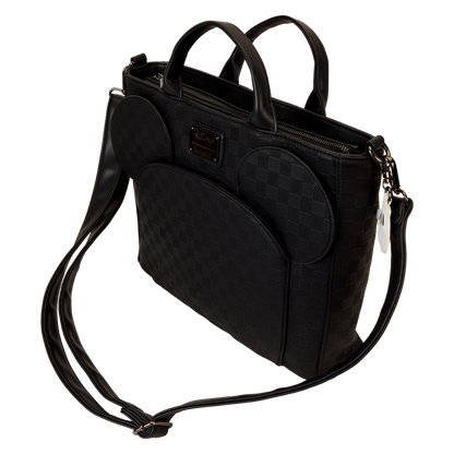 Black quilted handbag with a shoulder strap on a white background
