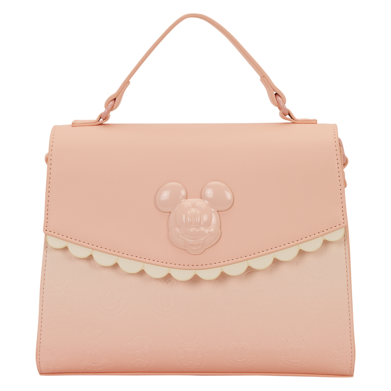 Pink handbag with a character face design on a white background