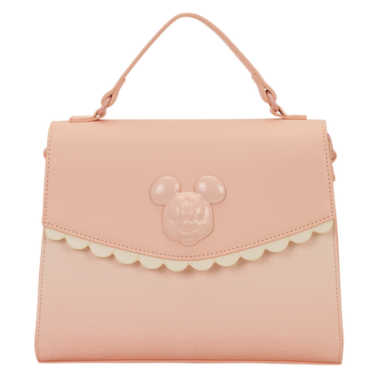 Pink handbag with a character face design on a white background