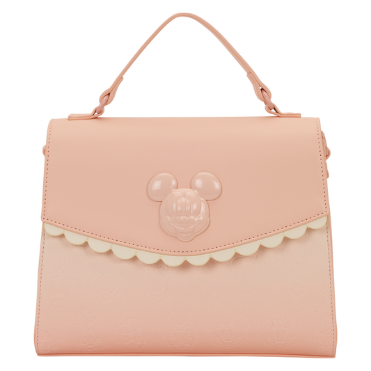 Pink handbag with a character face design on a white background