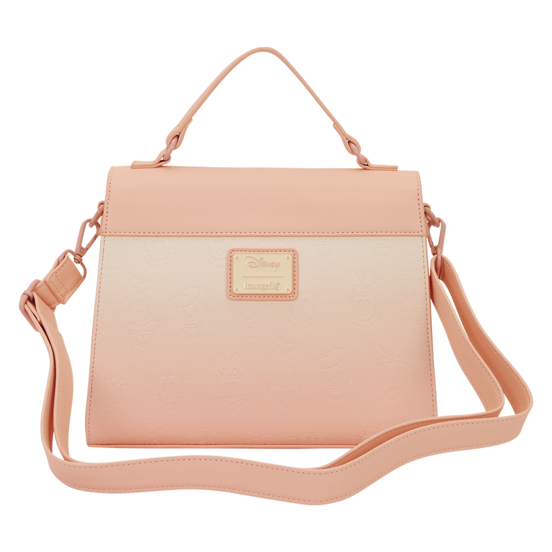 Pink crossbody bag with a visible brand logo on a white background