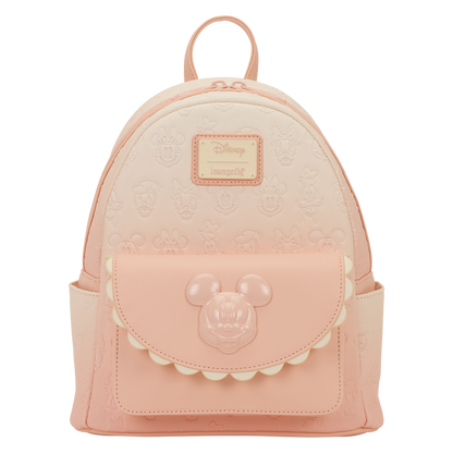 Pink backpack with a Disney logo and character emblem on a white background