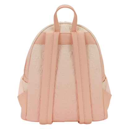 Pink backpack with floral pattern on a white background