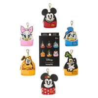All six Mickey and Friends mini backpack keychain charms arranged around the mystery box packaging card