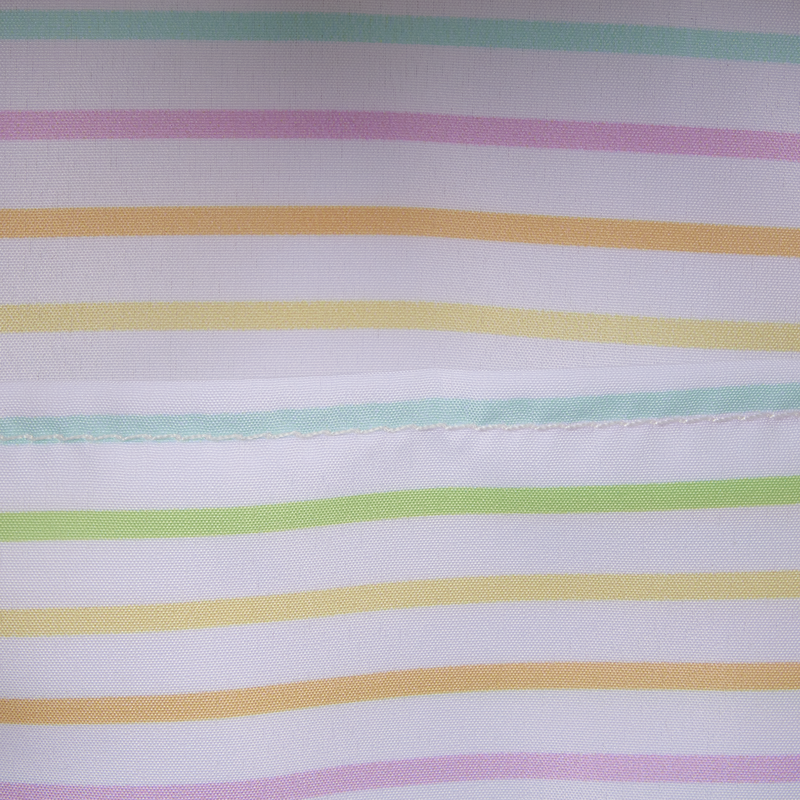 Close-up of fabric with multicolored stripes on a white background