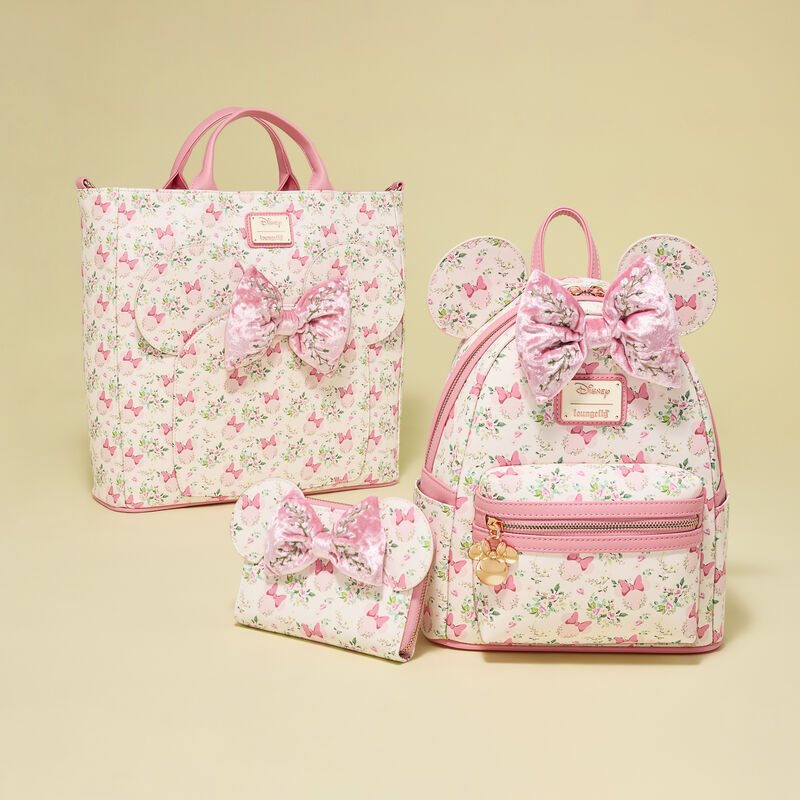 Set of floral bags with pink bows on a beige background