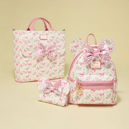 Set of floral bags with pink bows on a beige background