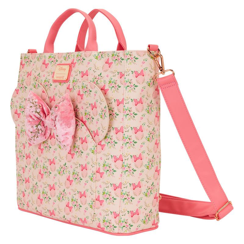 Pink floral backpack with a bow on a white background