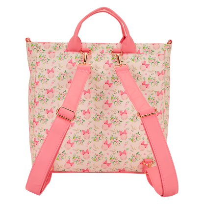 Backpack with pink floral pattern and straps on a white background