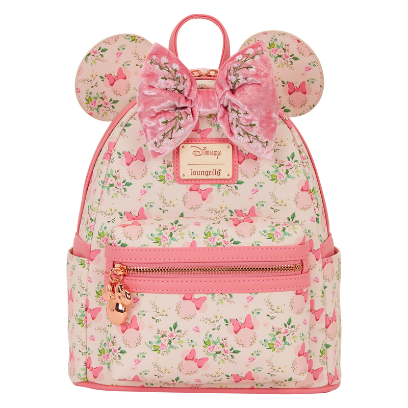 Pink backpack with floral pattern and bow design on a white background