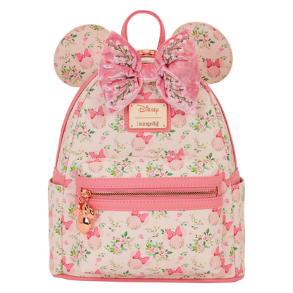 Pink backpack with floral pattern and bow design on a white background