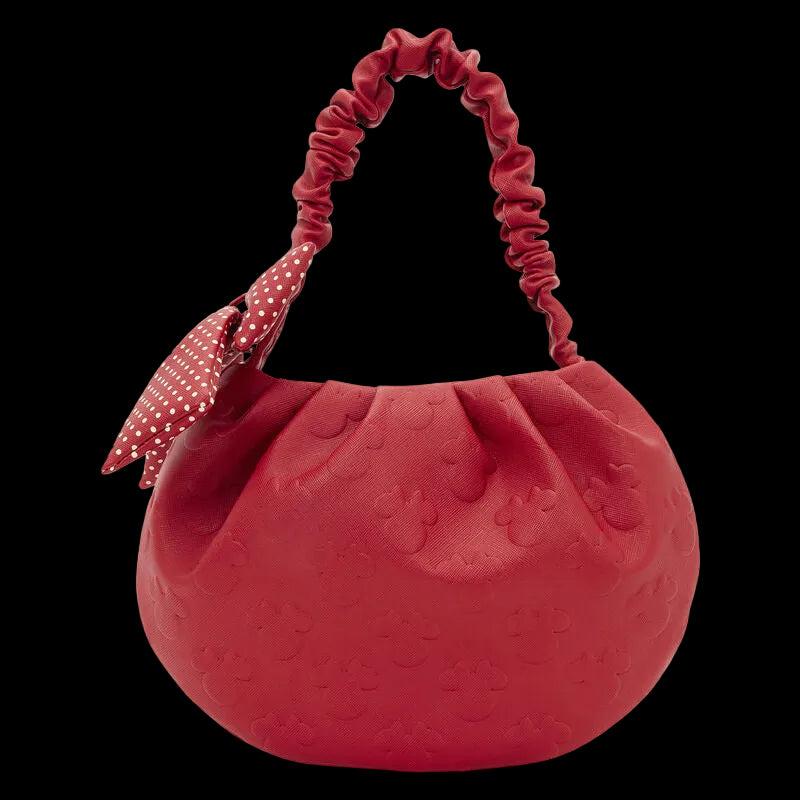 Red textured handbag with a ruched handle on a white background