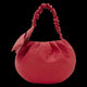 Red textured handbag with a ruched handle on a white background