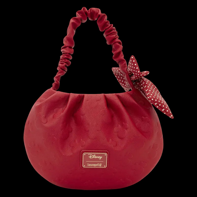 Red handbag with decorative bow on a white background