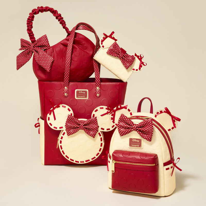 Red and cream bags with bow details on a beige background