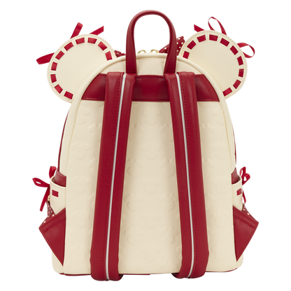 Backpack with red straps and decorative elements on a white background