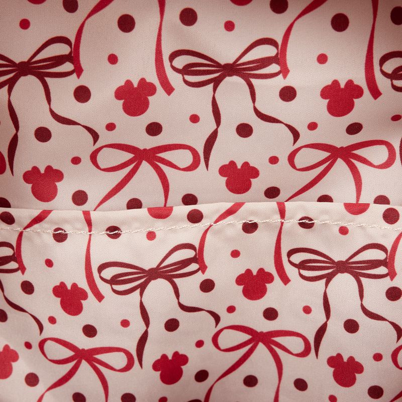 Pattern of red bows and paw prints on a white background