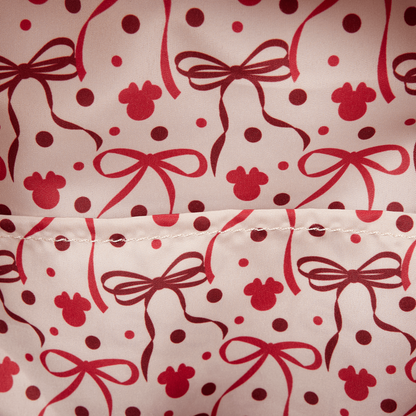 Pattern of red bows and paw prints on a white background