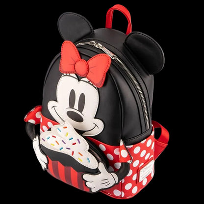 Backpack designed like a character with a red bow and polka dot details on a white background