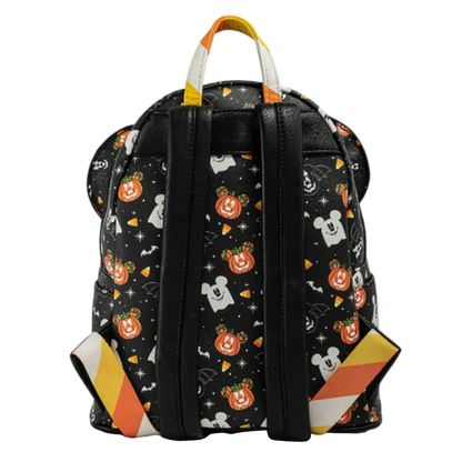 Backpack with Halloween-themed design featuring pumpkins, ghosts, and candy corn on a black background.