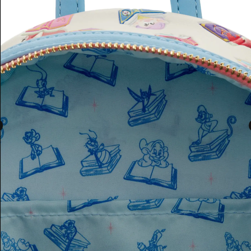 Close-up of a blue bag with cartoon character illustrations on a light blue background