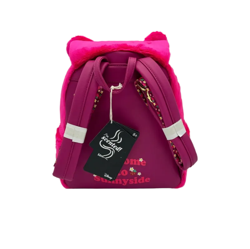 Pink backpack with cat ears and a tag on a light gray background