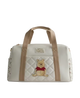Bag with Winnie the Pooh design on a light gray background