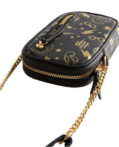 Black handbag with gold chain strap and detailed design on a light gray background