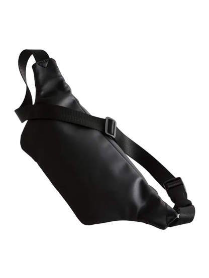 Black leather waist bag on a light gray background