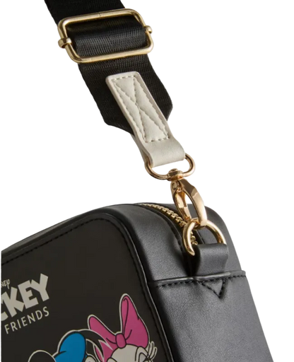 Black bag with gold zipper and strap, featuring a character design on a light gray background