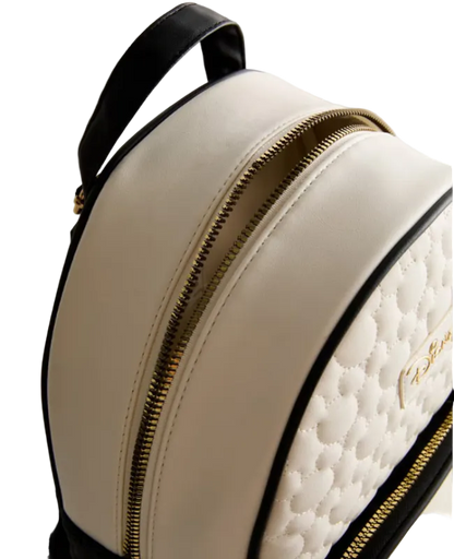 Beige backpack with gold zipper and black handle on a light gray background