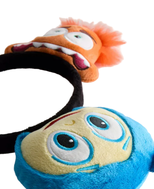 Two plush toys with exaggerated facial expressions on a white background
