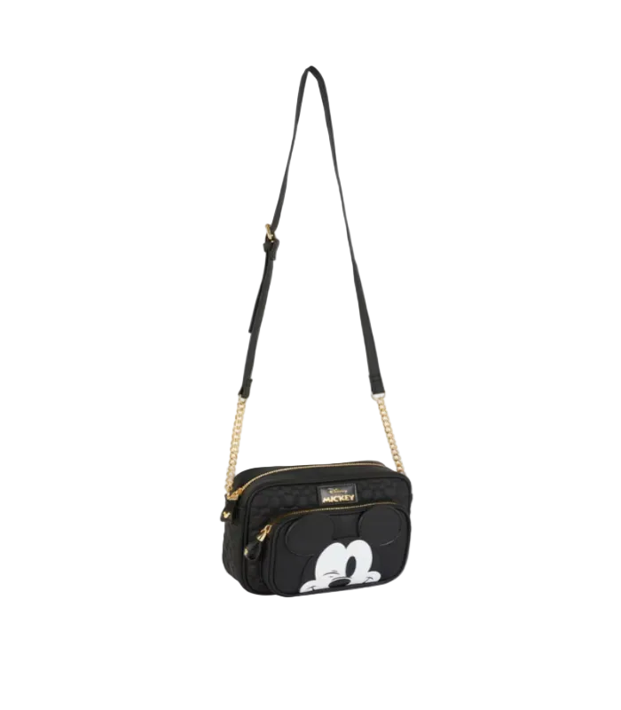 Black crossbody bag with a character design on a light gray background