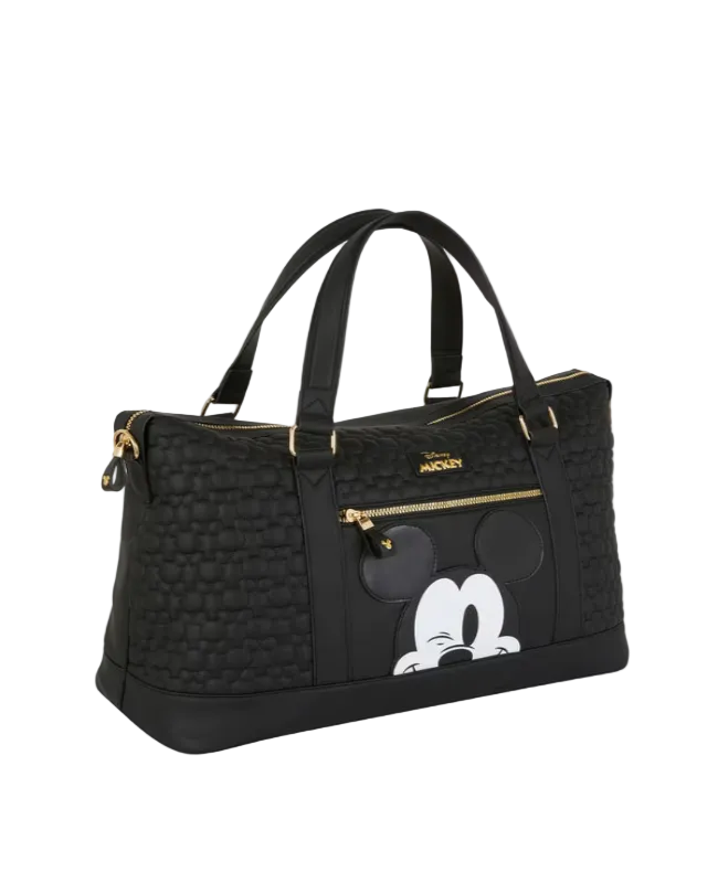 Black handbag with a cartoon character design on a light gray background