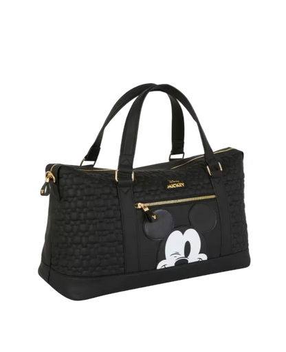 Black handbag with a cartoon character design on a light gray background