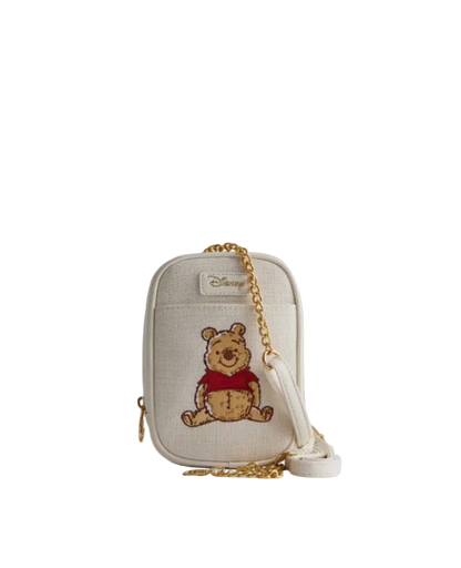 Small beige pouch with embroidered bear design on a white background