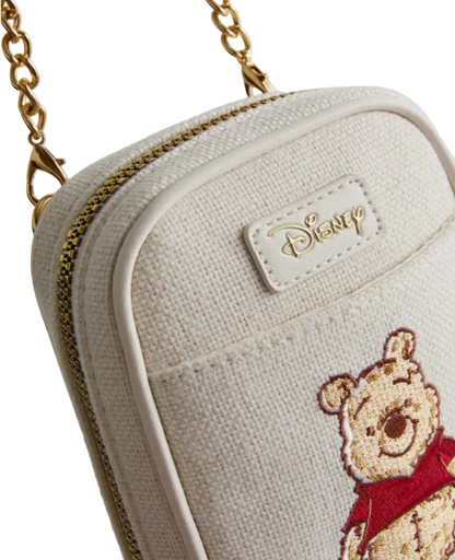 White pouch with embroidered bear design and Disney logo on a light gray background